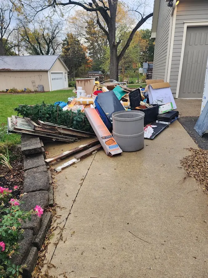 Dumpster being loaded with debris for Commercial Dumpster Rental in South Whitehall